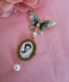 Single Photo Bouquet Charm on a Gold Butterfly Brooch.