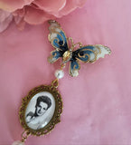 Single Photo Bouquet Charm on a Gold Butterfly Brooch.