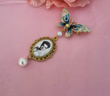 Single Photo Bouquet Charm on a Gold Butterfly Brooch.