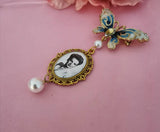 Single Photo Bouquet Charm on a Gold Butterfly Brooch.