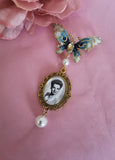 Single Photo Bouquet Charm on a Gold Butterfly Brooch.